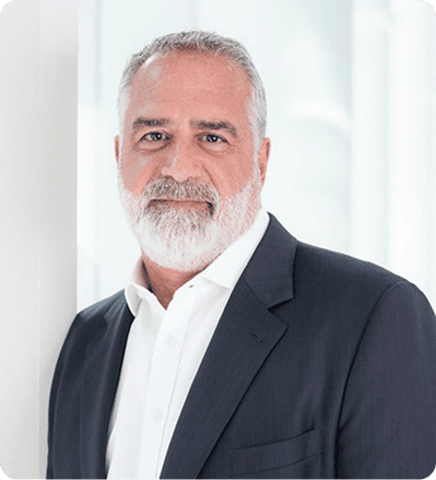 Mature businessman with gray beard in suit