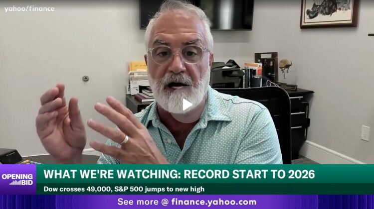 Bearded man speaking on finance news broadcast